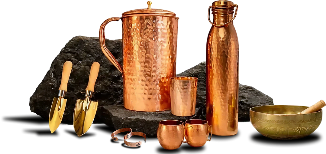 Handmade copper pitcher, bottle, tumblers, mugs, cuffs, garden tools and singing bowl on dark stone